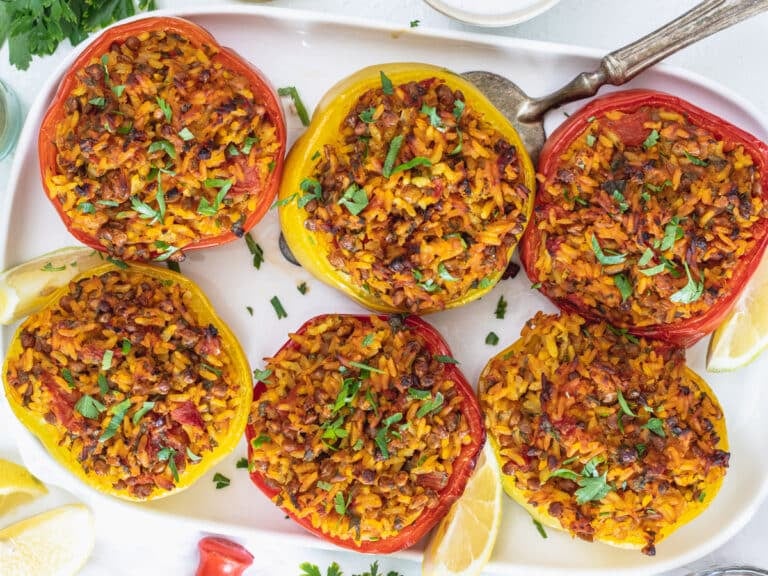 Stuffed bell peppers on a white platter