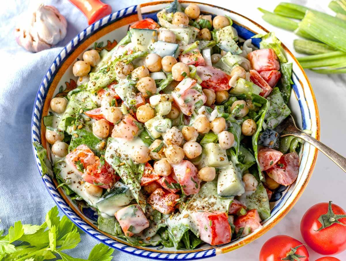 Tahini salad with chickpeas and cherry tomatoes in a bowl