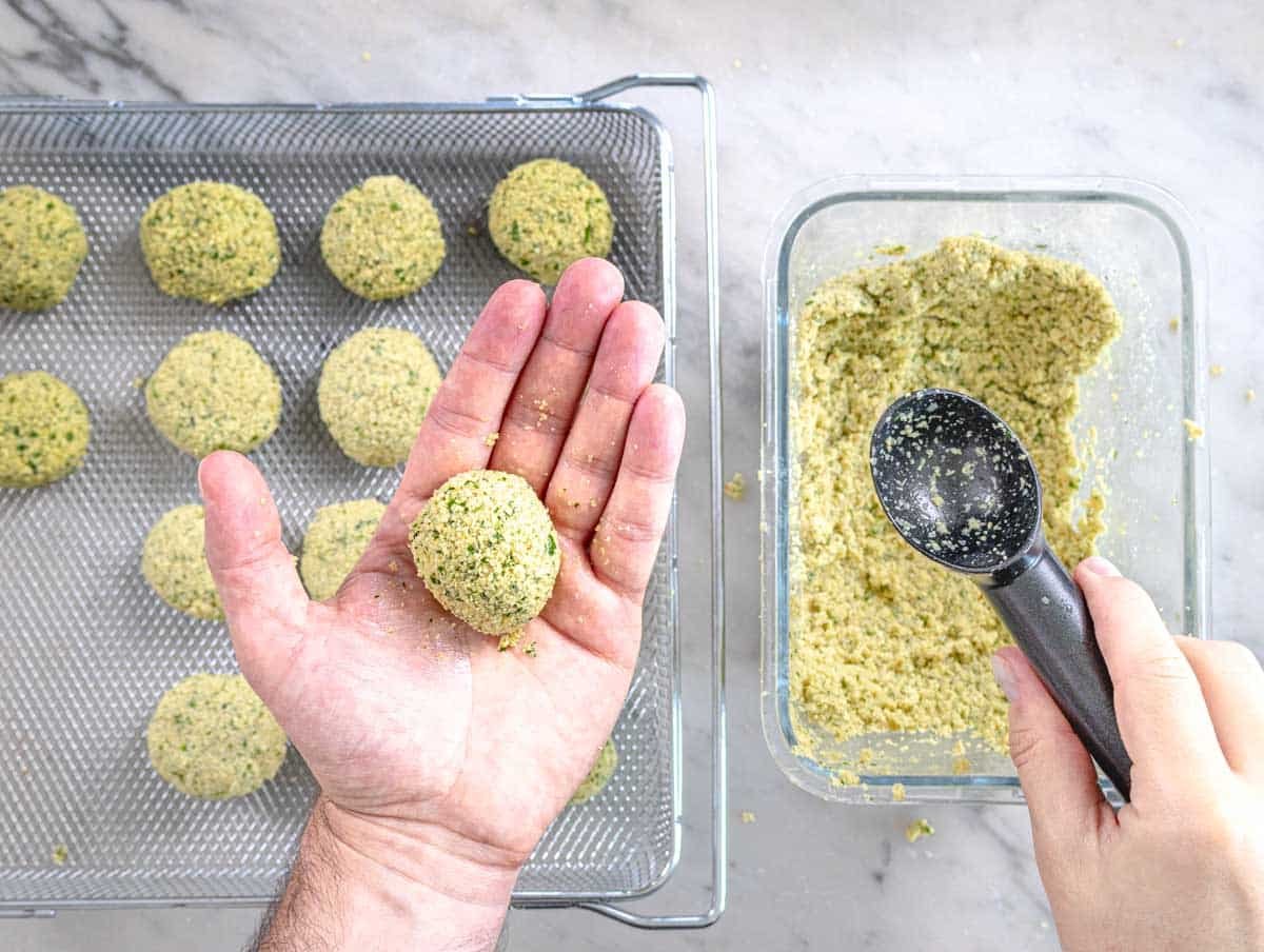 hands shaping falafel balls