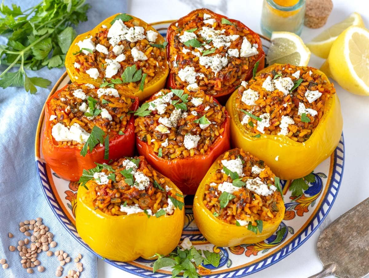 stuffed bell peppers with feta cheese and fresh parsley on a plate