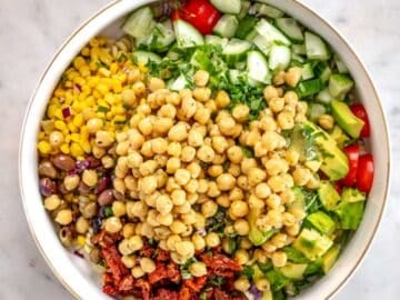 Chickpeas in a bowl with chopped vegetables