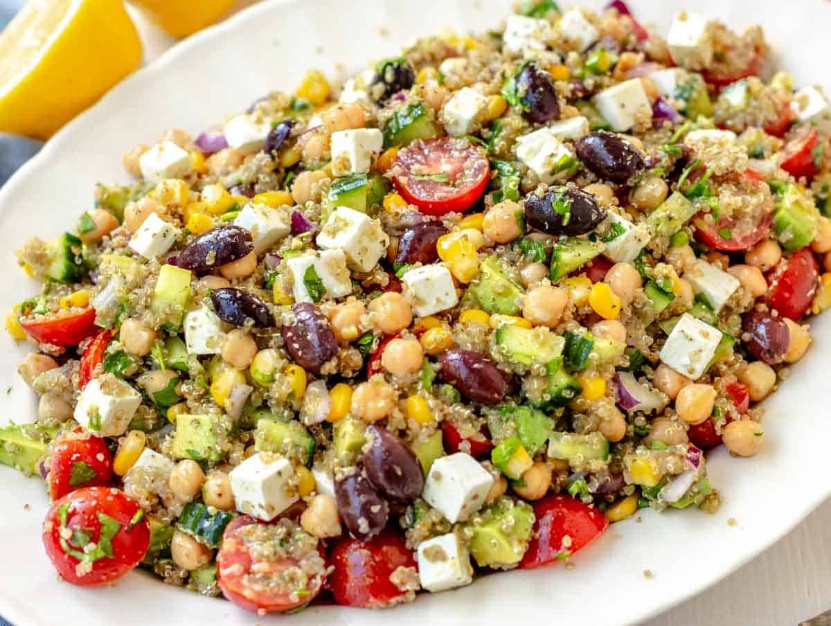 Chickpea quinoa salad with feta on a white platter