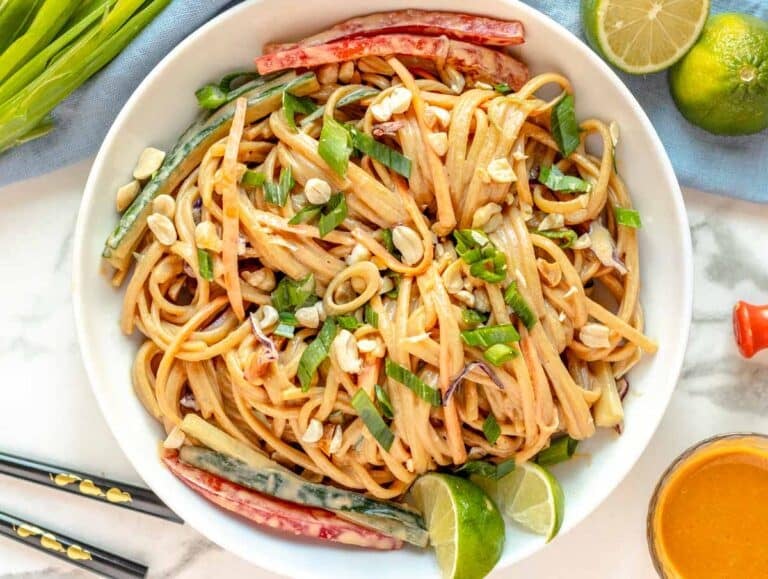 Peanut noodles with toasted peanuts and lime in a bowl