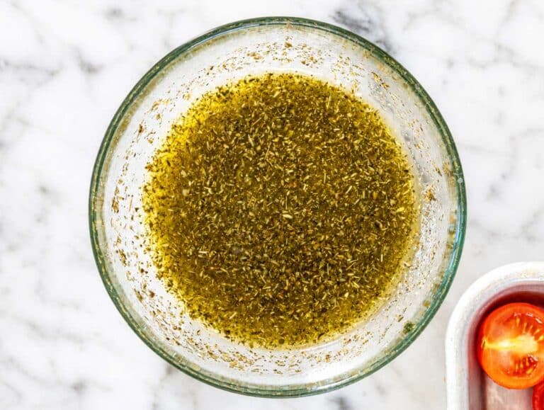 Step 1 Olive oil, garlic, oregano, sugar, and salt stirred together in a small bowl.