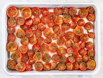 Step 2 Cherry tomato halves arranged cut side up with seasoned oil spooned over each.