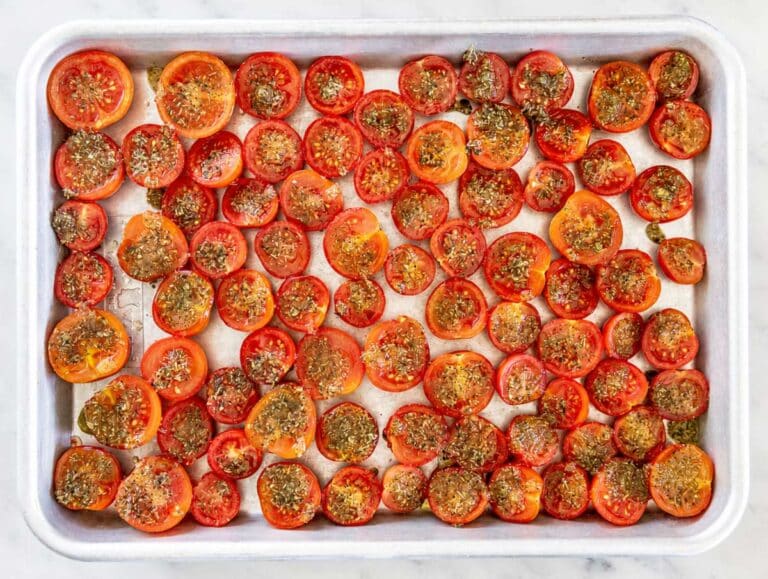 Step 2 Cherry tomato halves arranged cut side up with seasoned oil spooned over each.