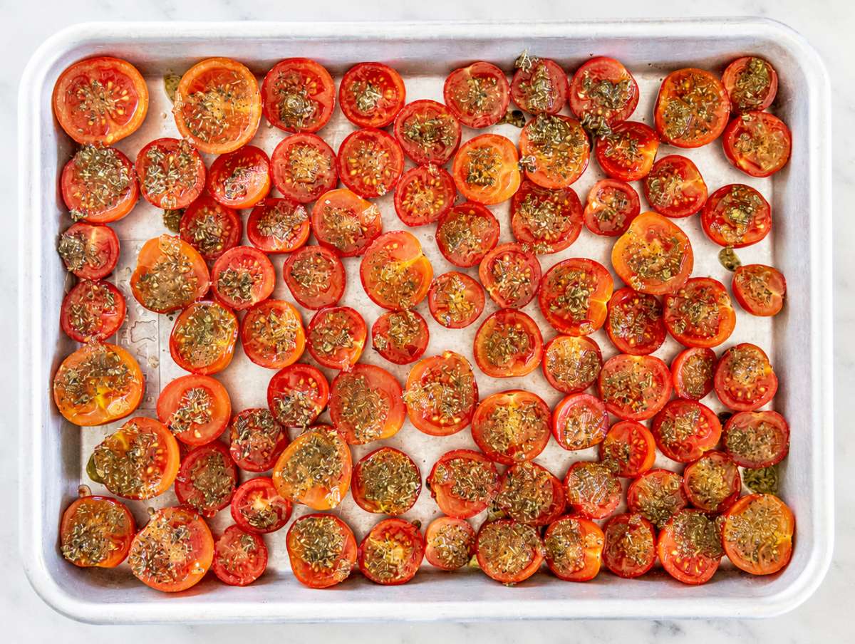 Step 2 Cherry tomato halves arranged cut side up with seasoned oil spooned over each.