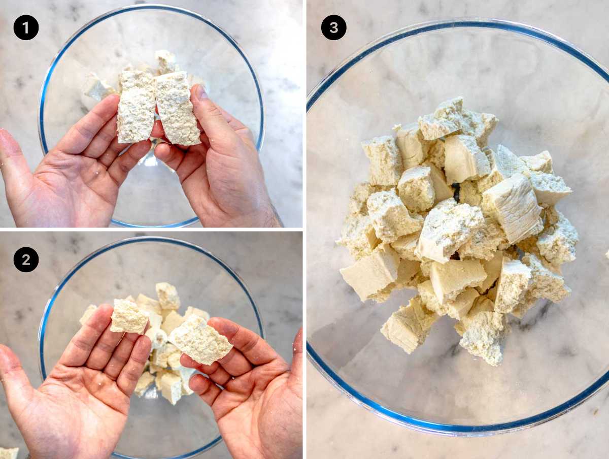 breaking tofu into bite-size pieces