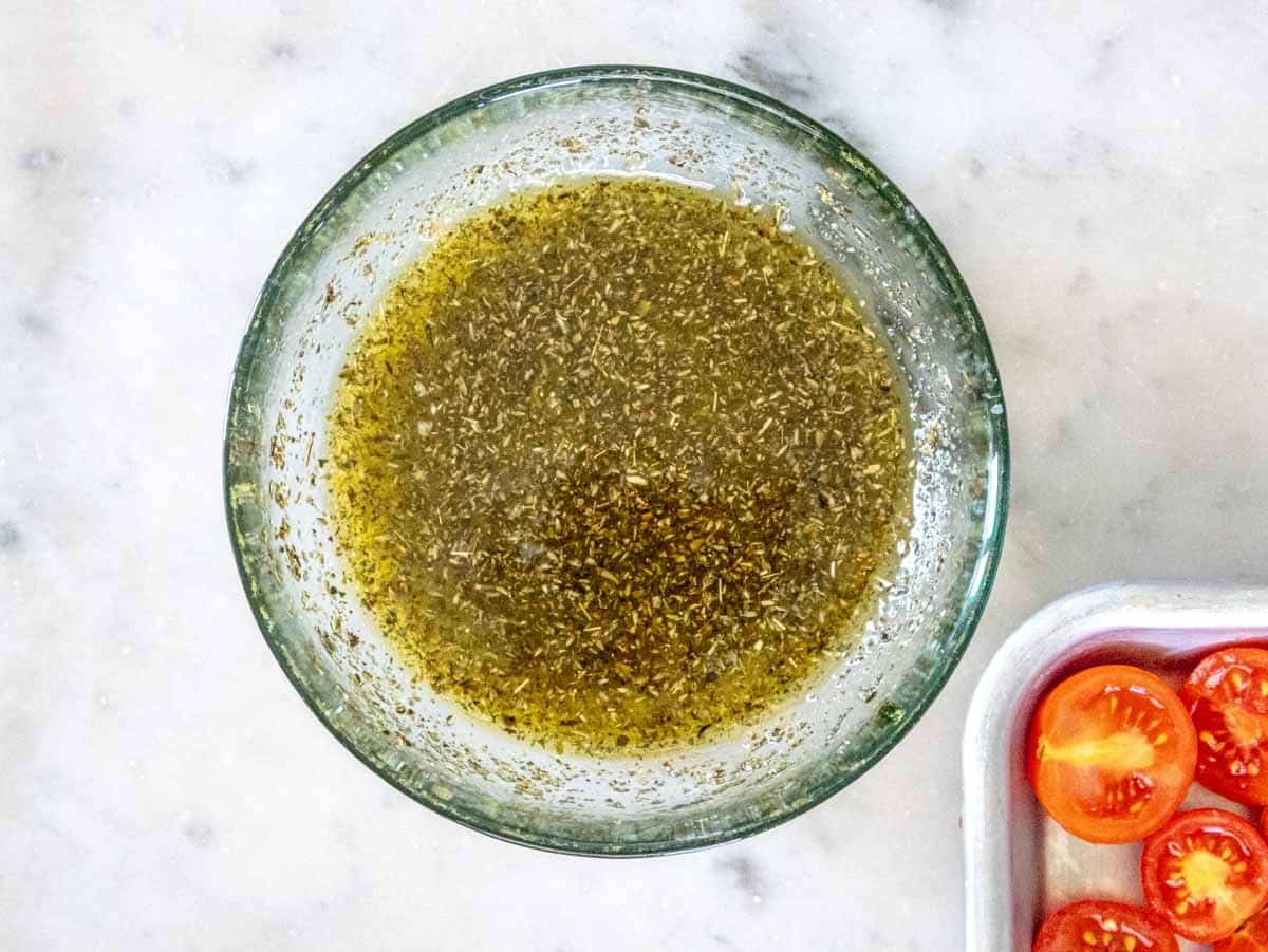 cherry tomatoes and oregano marinade in a bowl
