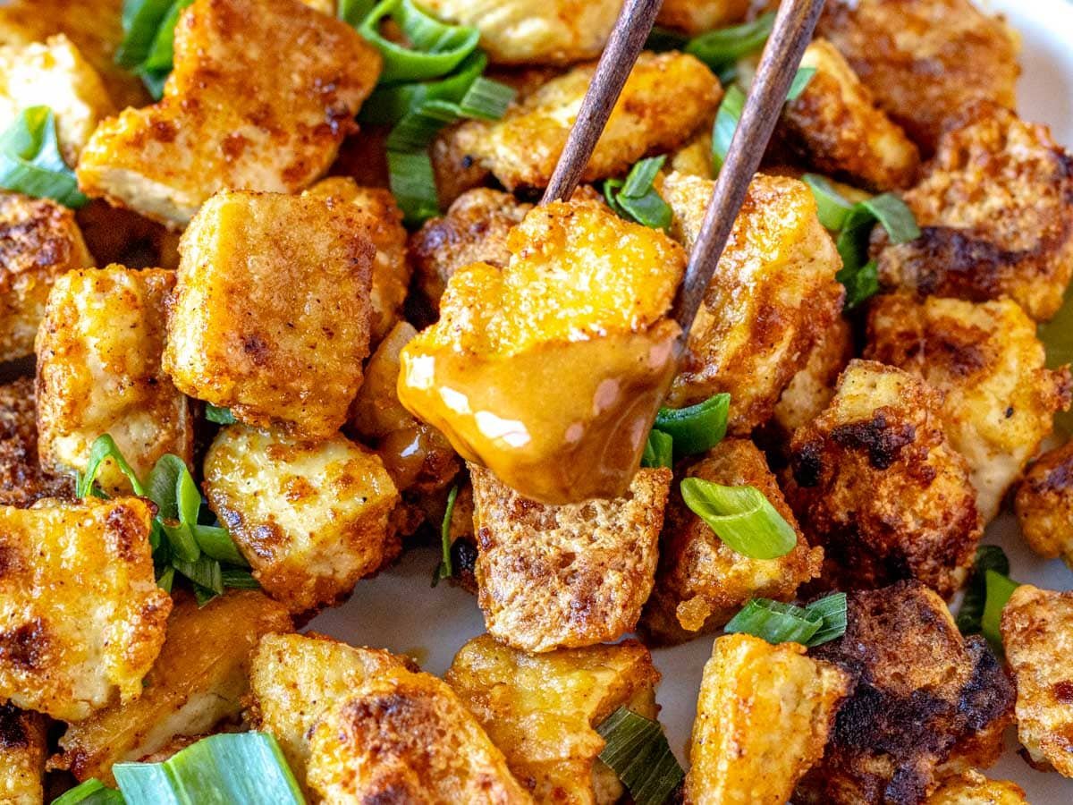 fried tofu bites dipped in peanut sauce