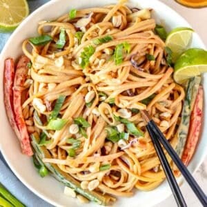 peanut noodles with chopsticks and vegetables