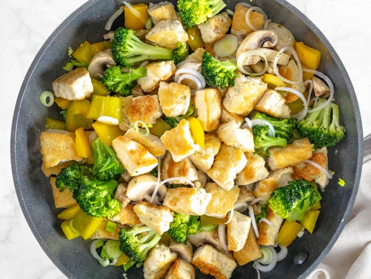 stir fried tofu and veggies in a pan