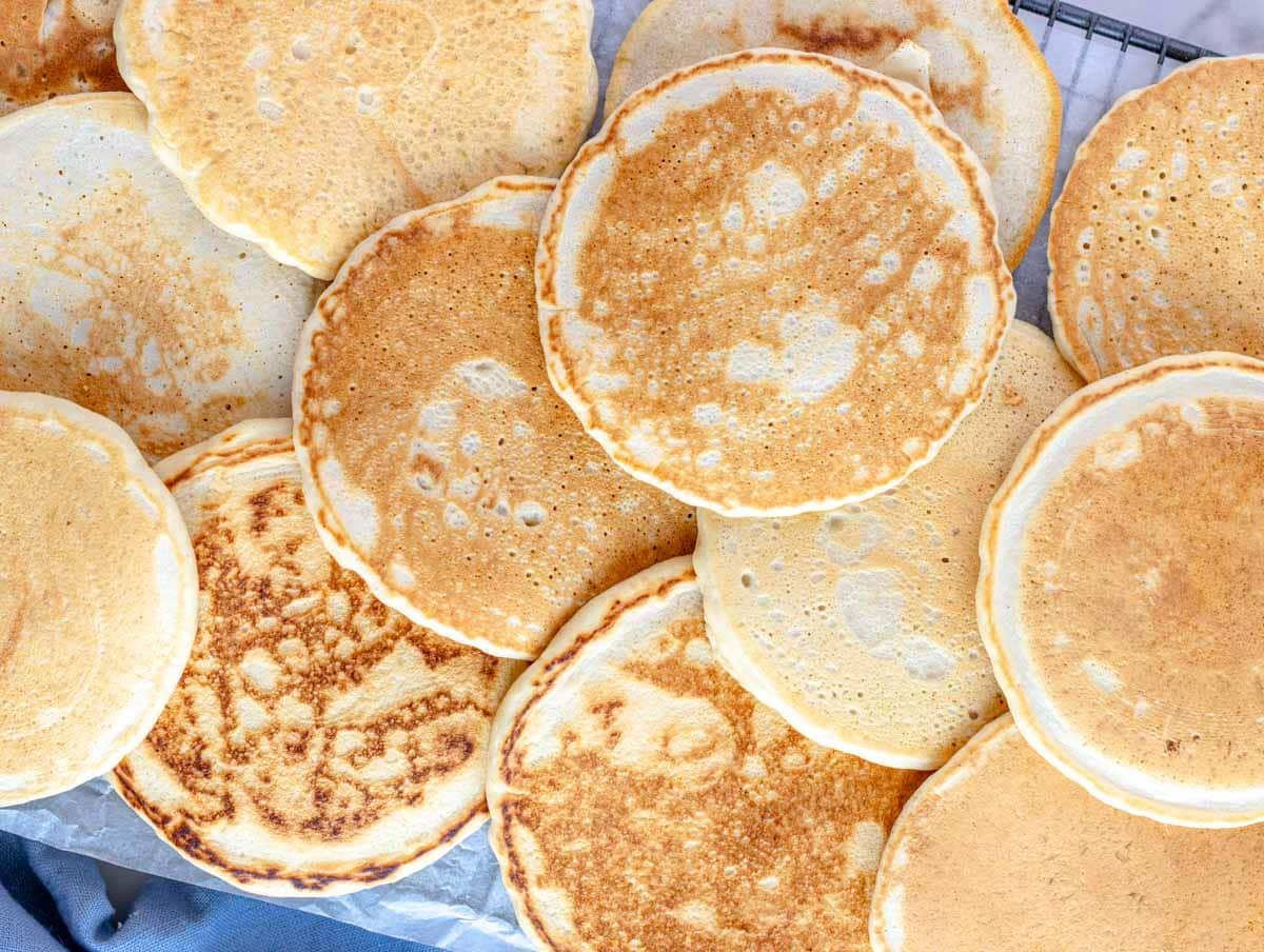 vegan pancakes on a rack to keep warm in the oven