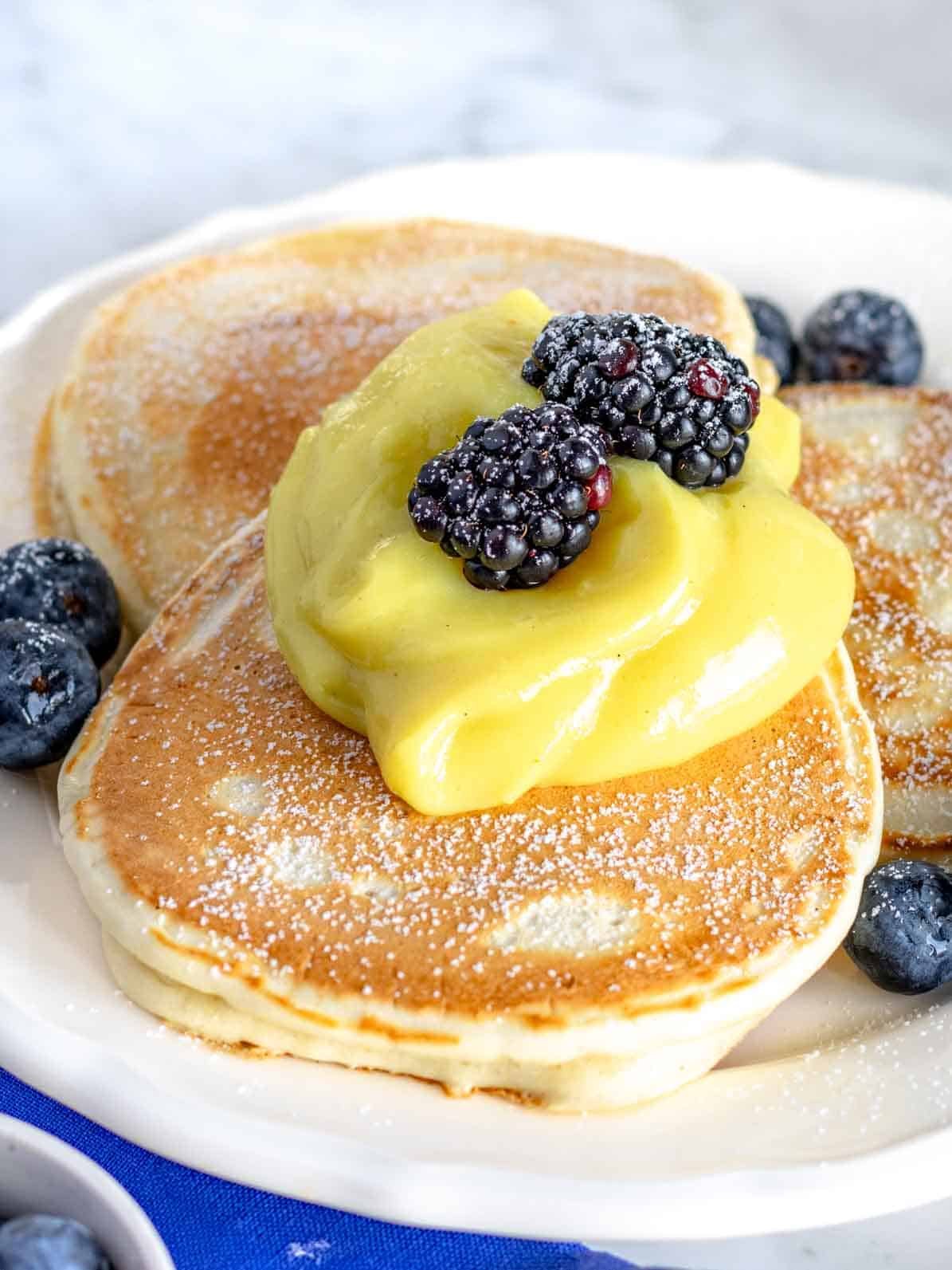 vegan pancakes with vegan custard and forrest berries.