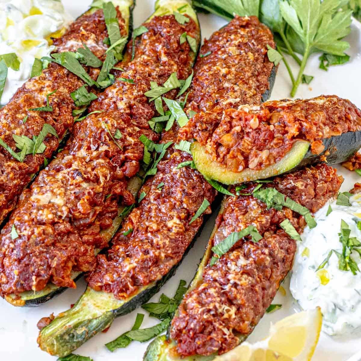 zucchini boats cut in half on a plate
