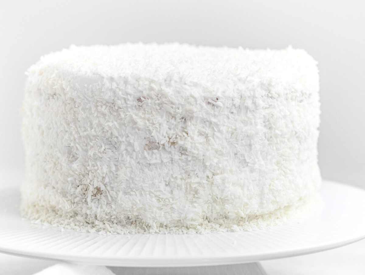 vegan coconut cake with coconut flakes