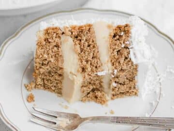 slice of vegan coconut cake with a silver fork