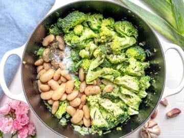 broccoli, white beans, salt, and pepper in a Dutch oven