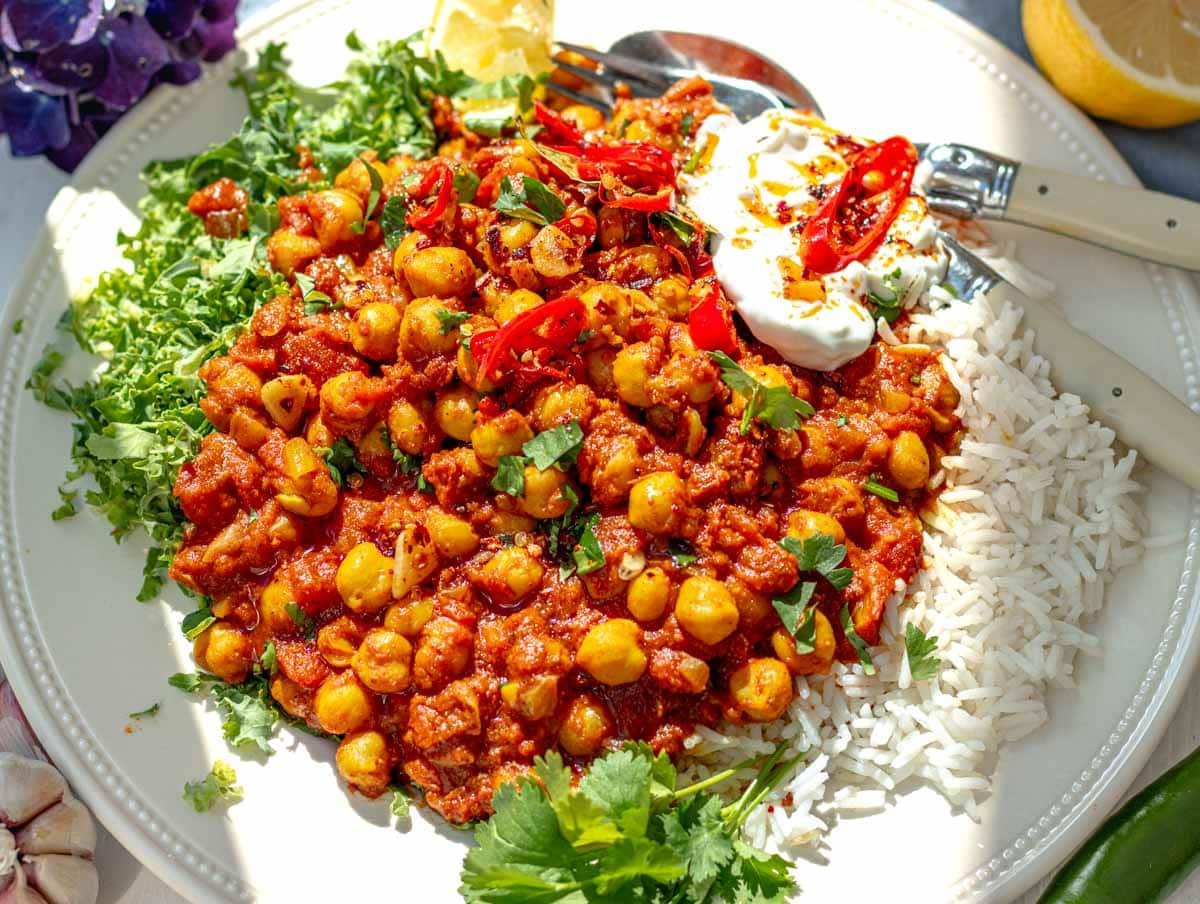 Chana masala with rice and kale on a plate