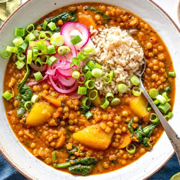 Curry lentil soup with tender lentils, rice and vegetables in spiced tomato broth.