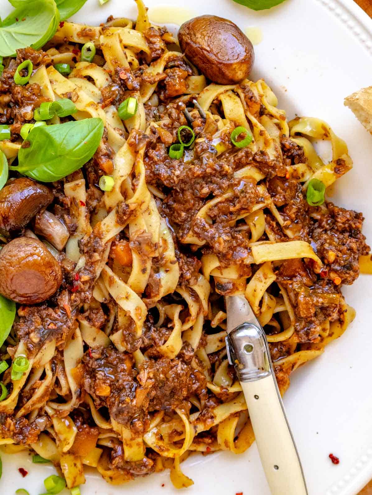 Easy mushroom bolognese with fettuccine and a fork