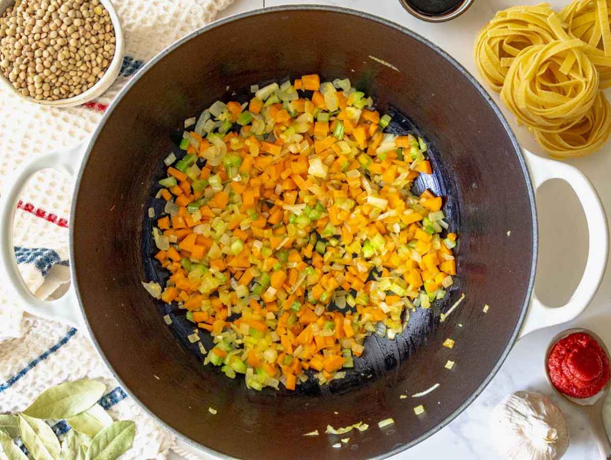 Step 1 Finely chopped onion, celery, carrot, and garlic cooking in olive oil in a large pot until beginning to soften.