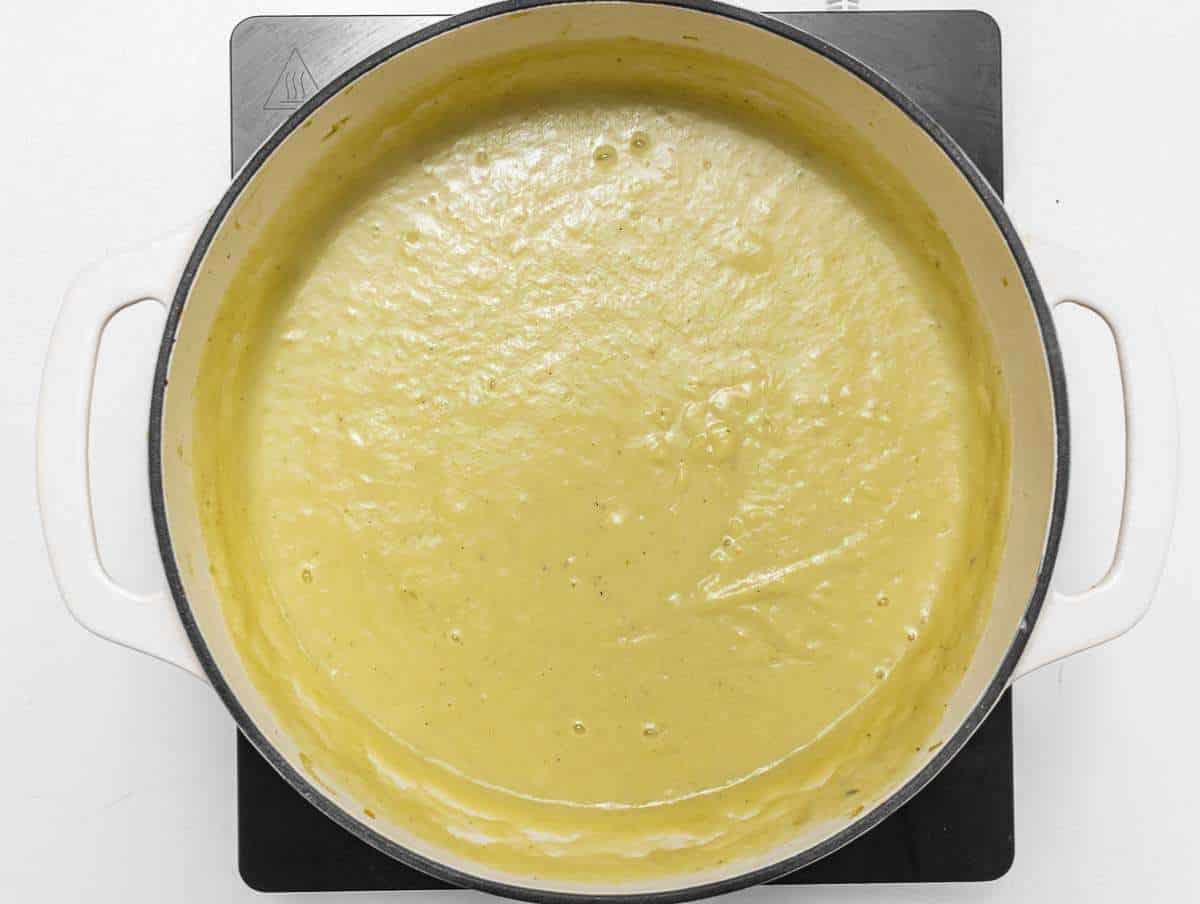 Step 3 Blending creamy potato leek soup with skyr using an immersion blender.