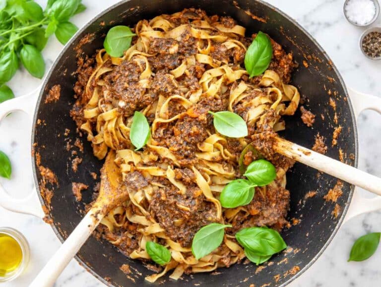 Step 4 Fettuccine tossed with mushroom ragu, then finished with basil and parmesan.