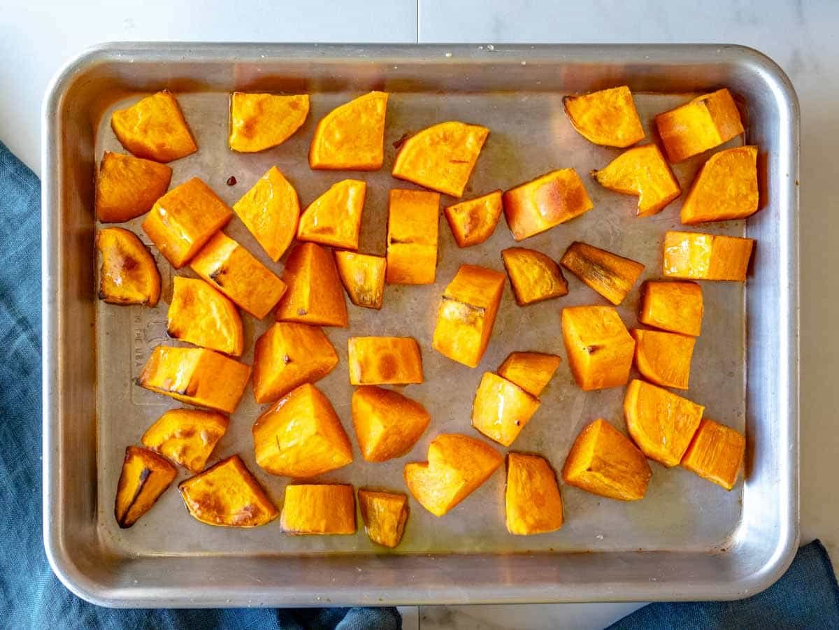 roasted sweet potato dice on a baking tray