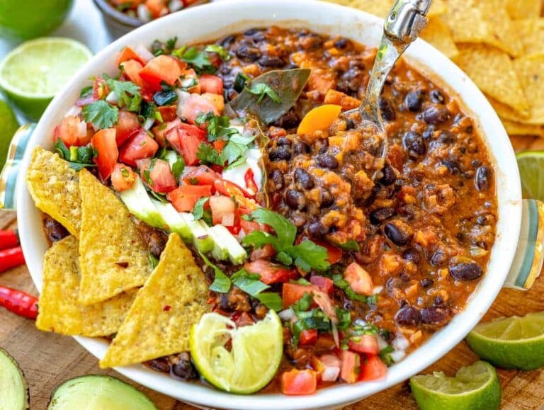 black bean soup topped with tortilla, pico de gallo, avocado, sour cream, cilantro, and lime juice.