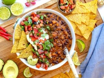black bean soup with nachos and a spoon