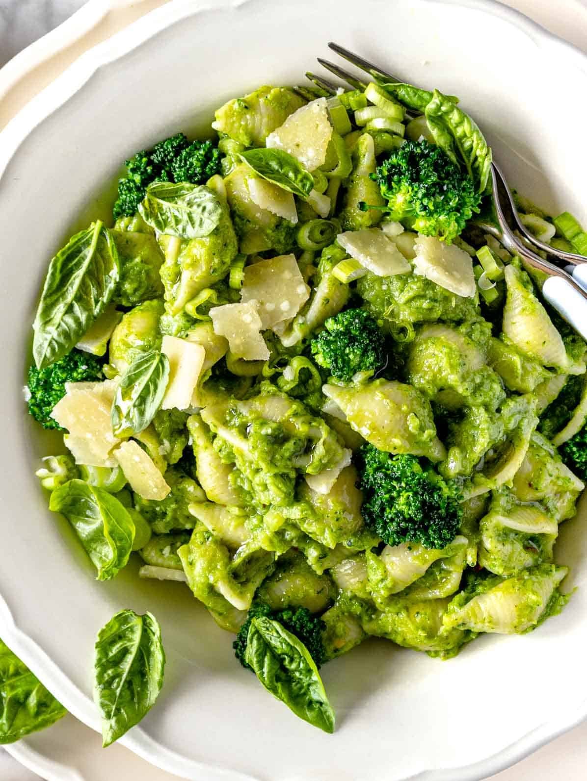 broccoli pasta with fresh basil and a fork