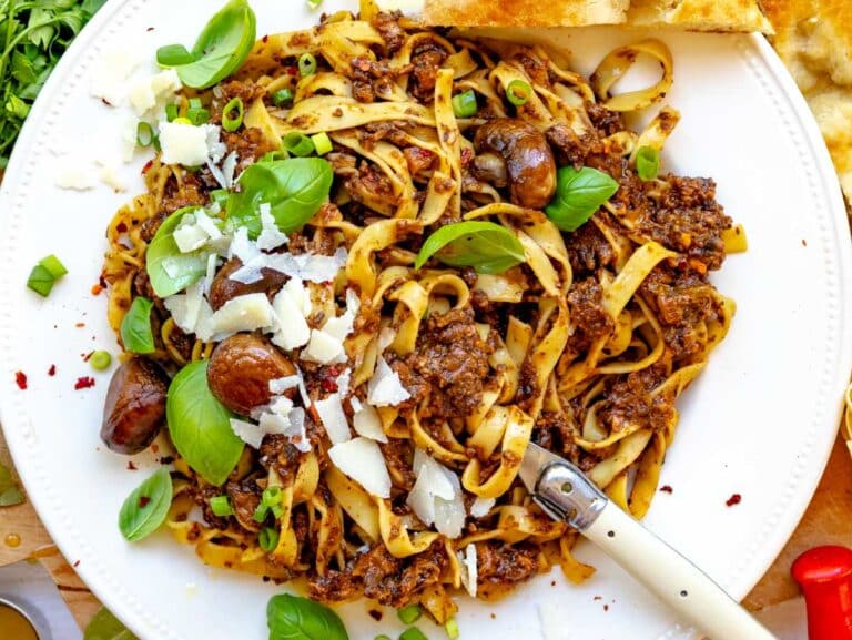 mushroom bolognese with parmesan cheese and fresh basil