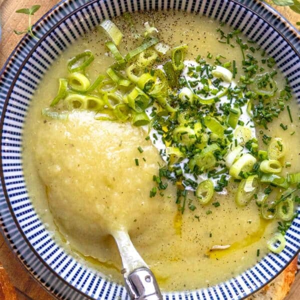 potato leek soup with chives and a spoon