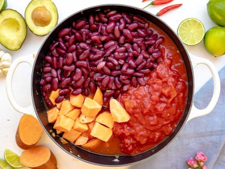 kidney beans, sweet potatoes, and diced tomatoes added to the pot