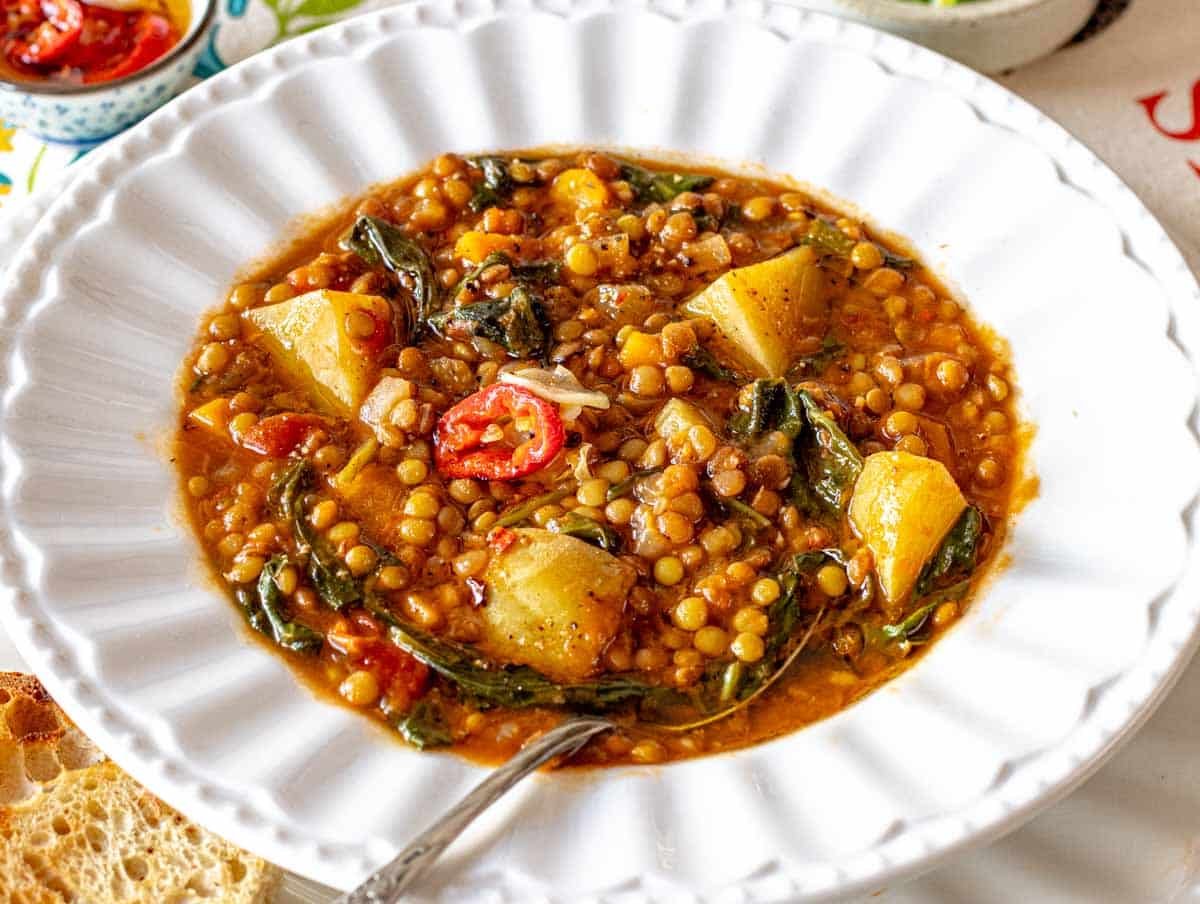 warm lentil soup in a white bowl