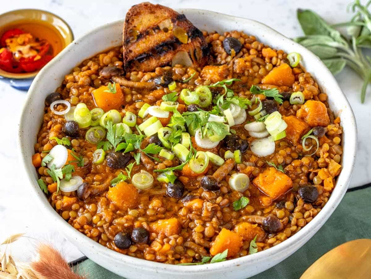 lentil stew topped with spring onions