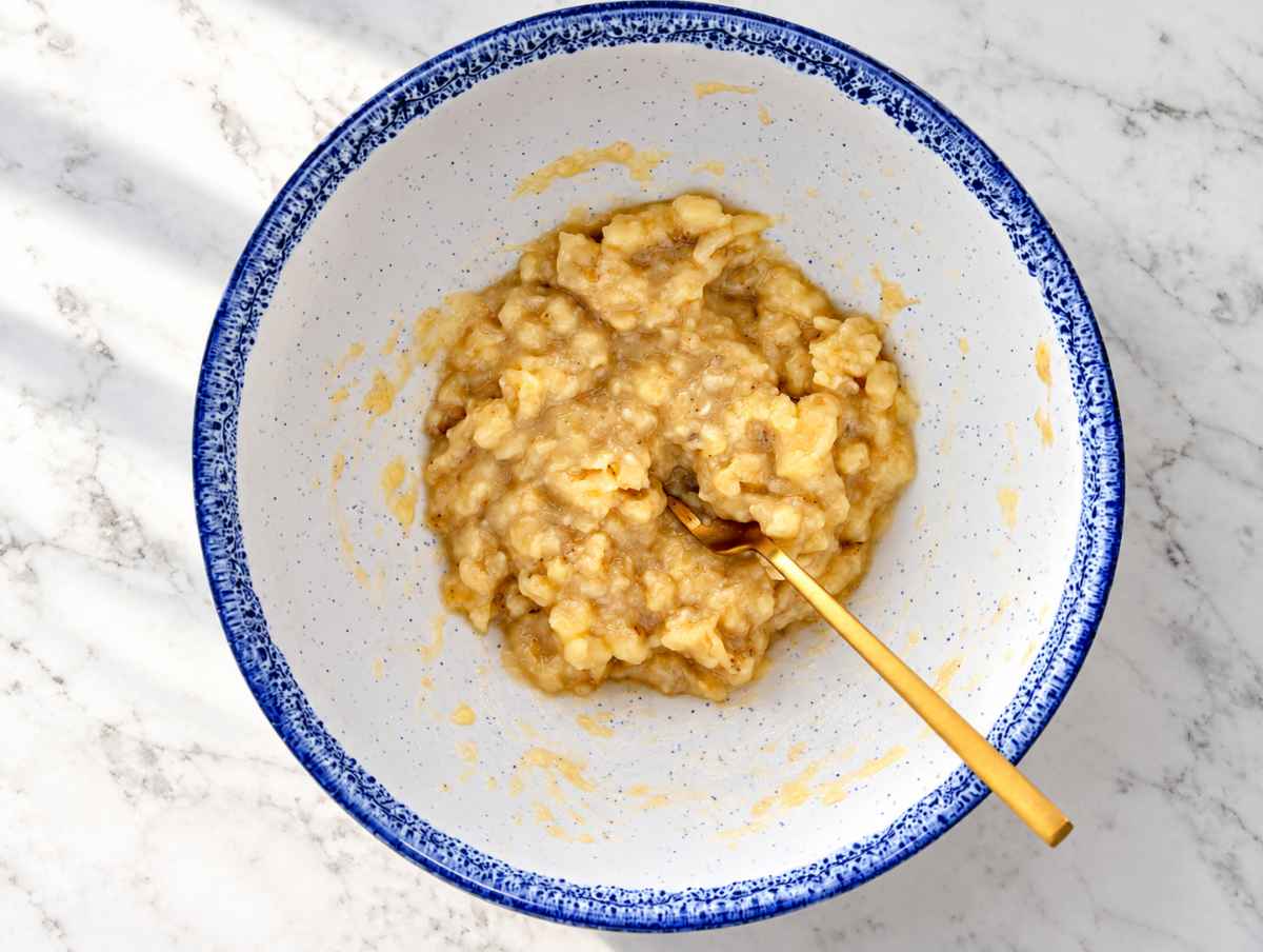 Step 1 Ripe bananas mashed with a fork until mostly smooth.