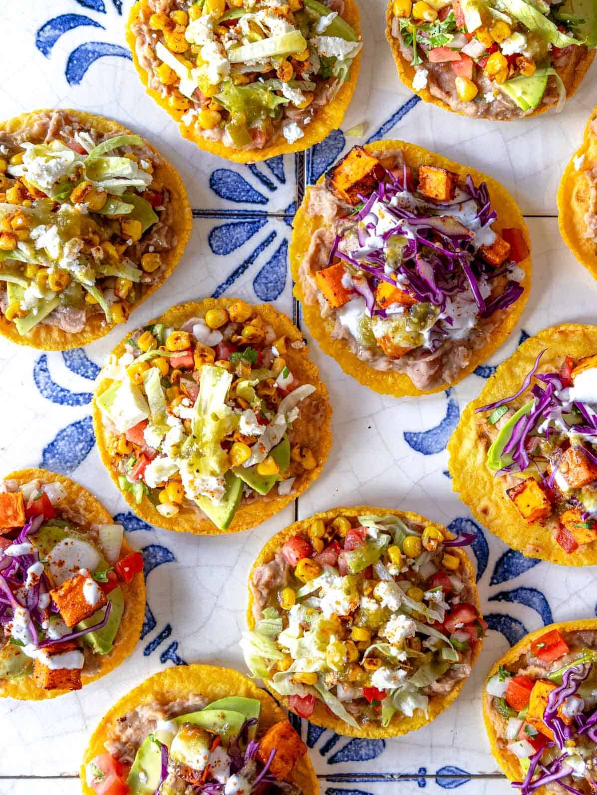 Tostadas with refried beans on blue tiles