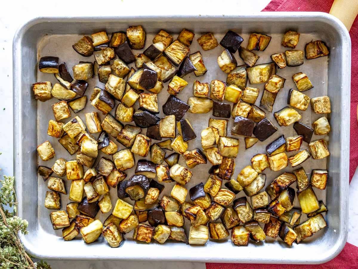 Roasted eggplant dice on a baking tray