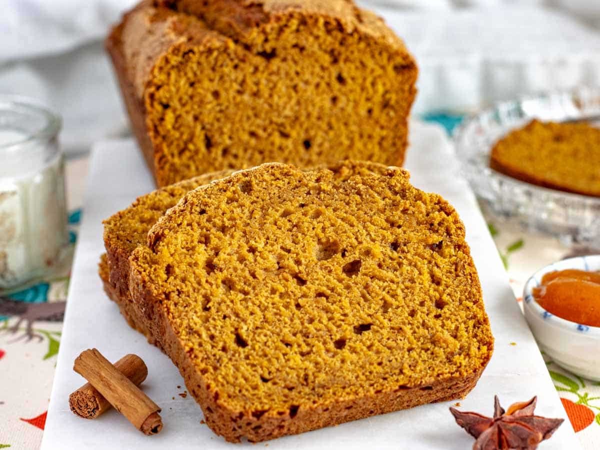 a close up of a slice of vegan pumpkin bread