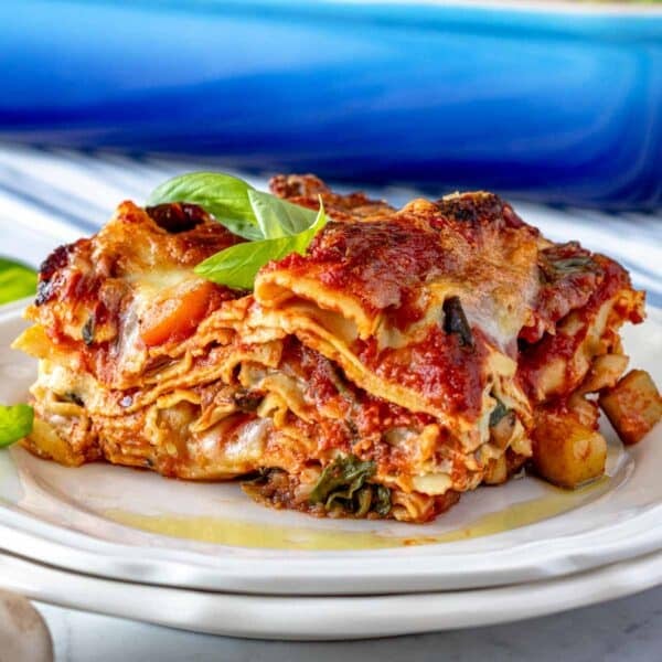 vegetable lasagna with diced vegetables and basil on a plate