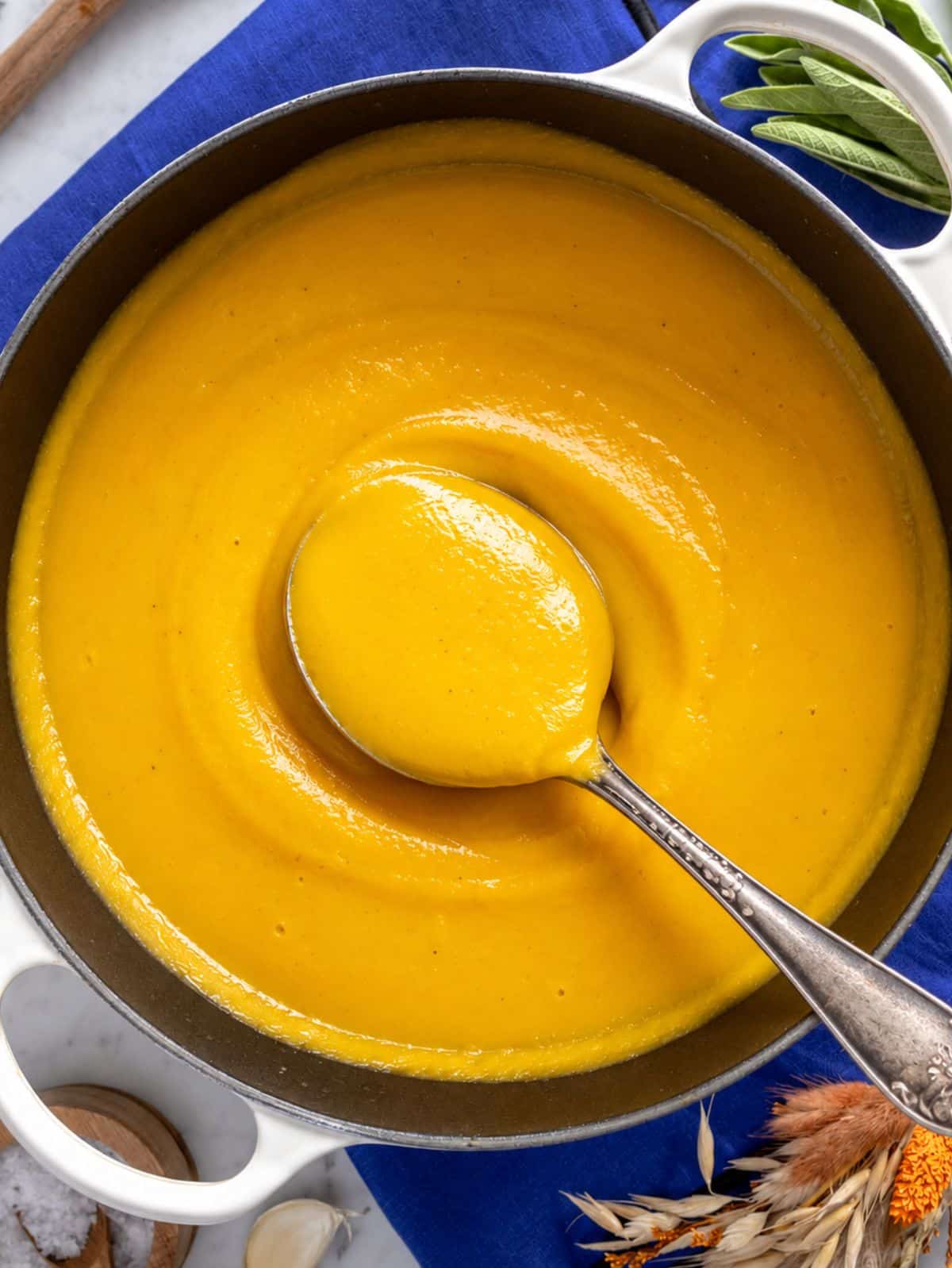 Close up of creamy butternut squash soup in a casserole.