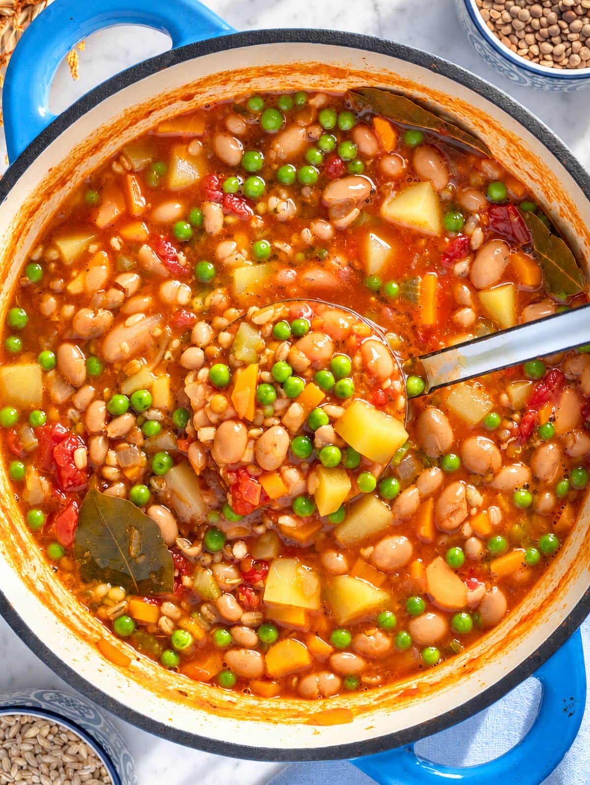 Hearty barley soup with beans, potatoes, lentils, peas, and vegetables.