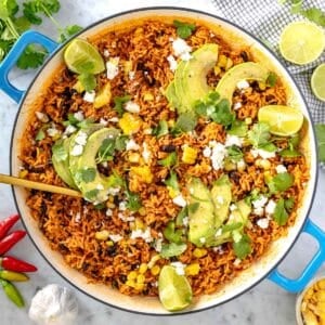 Mexican rice with avocado and cilantro in a skillet