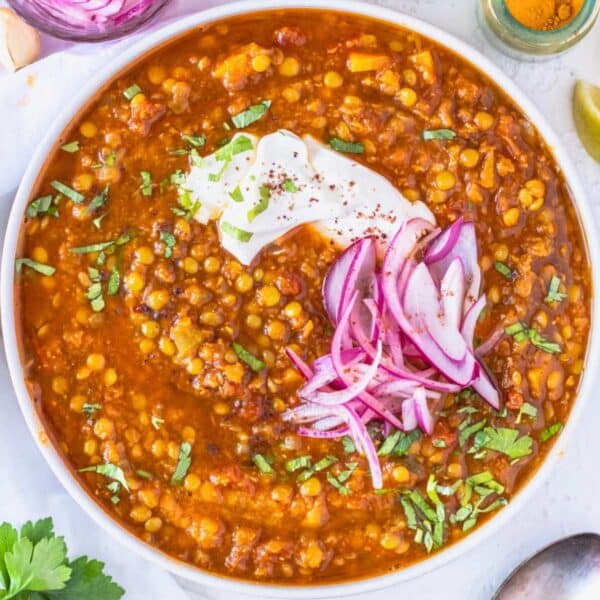 Moroccan lentil soup with pickled red onions, parsley, and yogurt