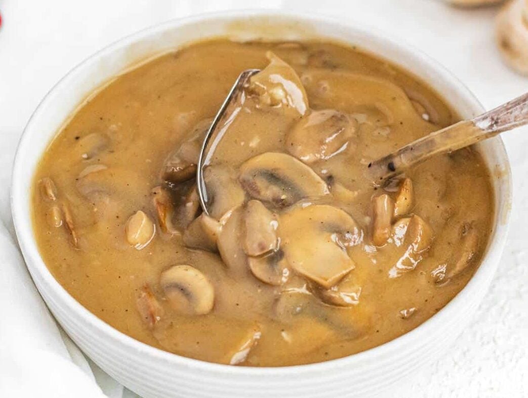 Mushroom gravy and spoon