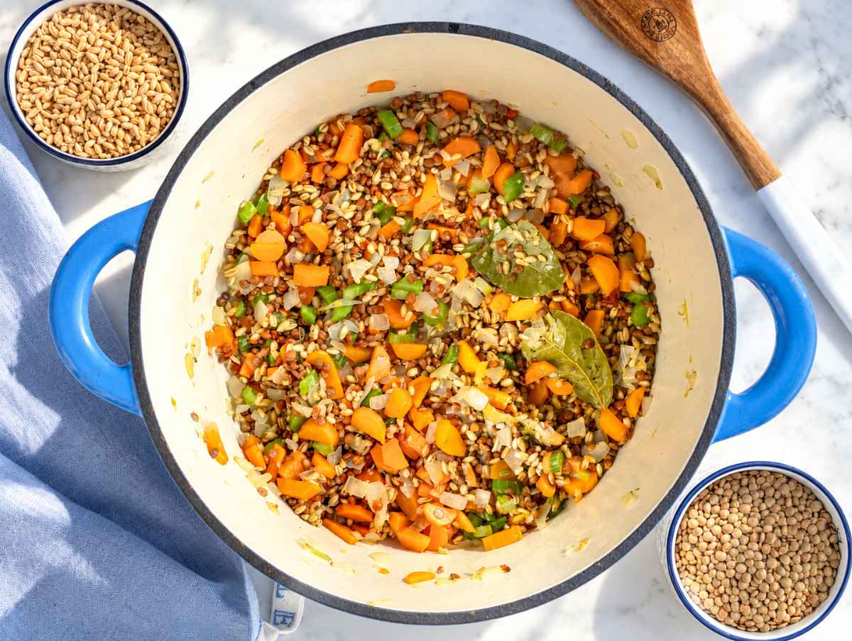Step 2 Pearl barley and lentils stirred into softened vegetables and aromatic herbs.