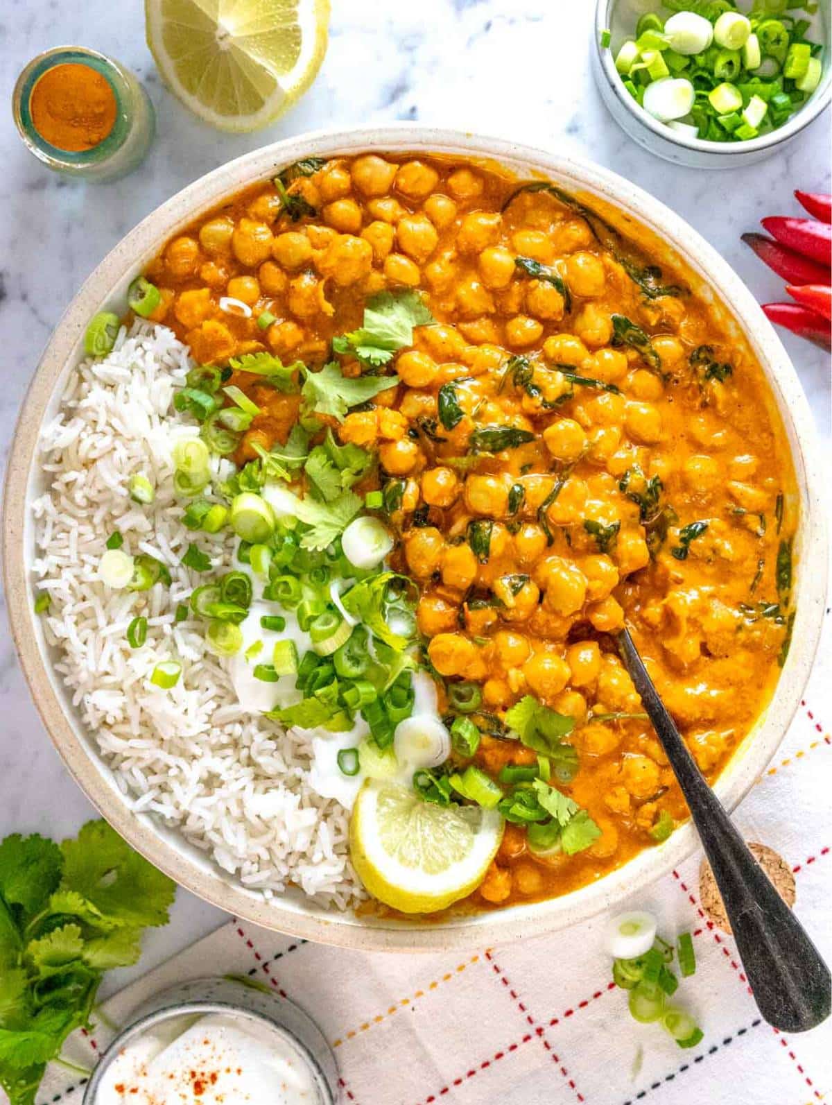 chickpea curry served with basmati rice, cilantro and lemon juice