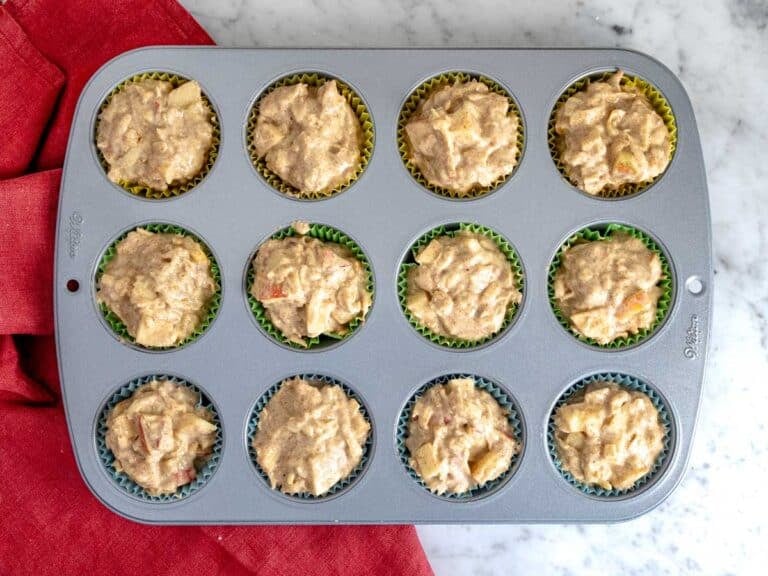 Muffin batter into the muffin tin.